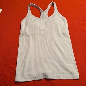 Lululemon racer back tank top in a baby powder blue color. Rubbed material Size6
